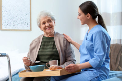 woman taking care of a senior woman